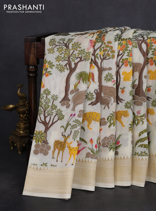 Dola silk saree cream with allover shikarga weaves and zari woven border