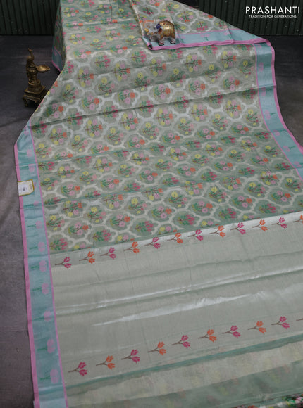 Cotton tissue zari kota saree green shade and pink with allover floral zari woven buttas and floral thread woven border