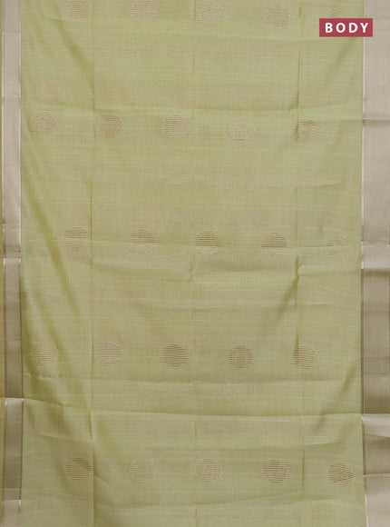 Semi dupion saree pista green with zari woven buttas and madhubani printed pallu & blouse
