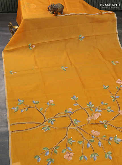Kota saree dark mustard with hand prints & kantha stitch work and zari woven piping border