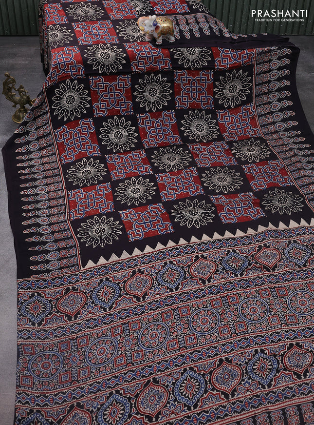 Modal silk saree black with allover ajrakh prints and printed pallu