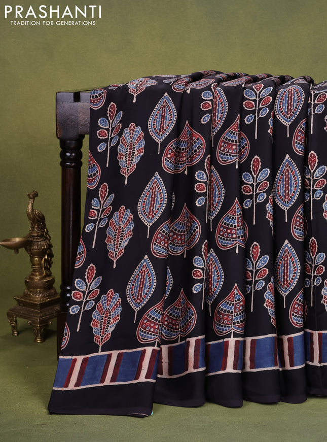 Modal silk saree black with allover ajrakh prints and printed pallu
