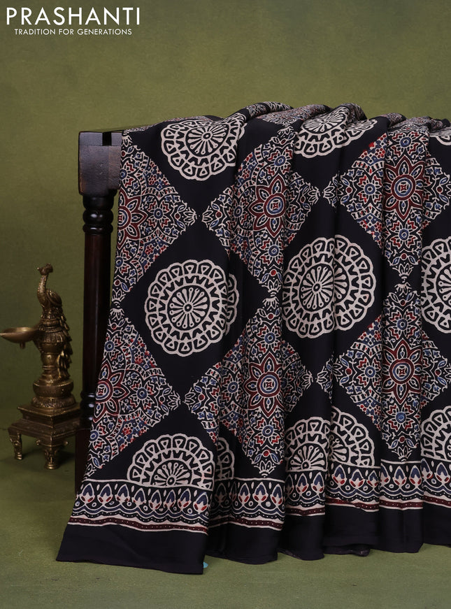 Modal silk saree black with allover ajrakh prints and printed pallu