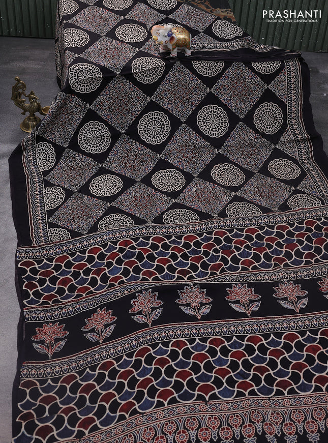 Modal silk saree black with allover ajrakh prints and printed pallu