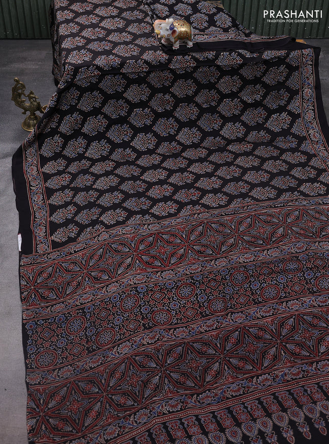 Modal silk saree black with allover ajrakh prints and printed pallu