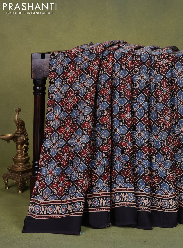 Modal silk saree black with allover ajrakh prints and printed pallu