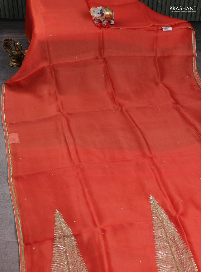 Pure organza silk saree orange with embroidery zari buttas and sequin embroidered border