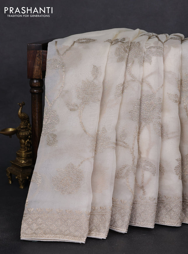 Pure organza silk saree off white with allover embroidery work and embroidered border