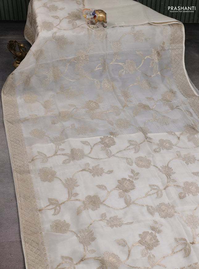 Pure organza silk saree off white with allover embroidery work and embroidered border