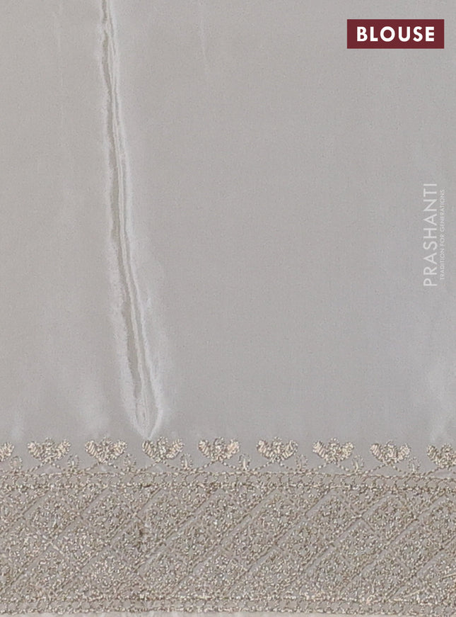 Pure organza silk saree off white with allover embroidery work and embroidered border