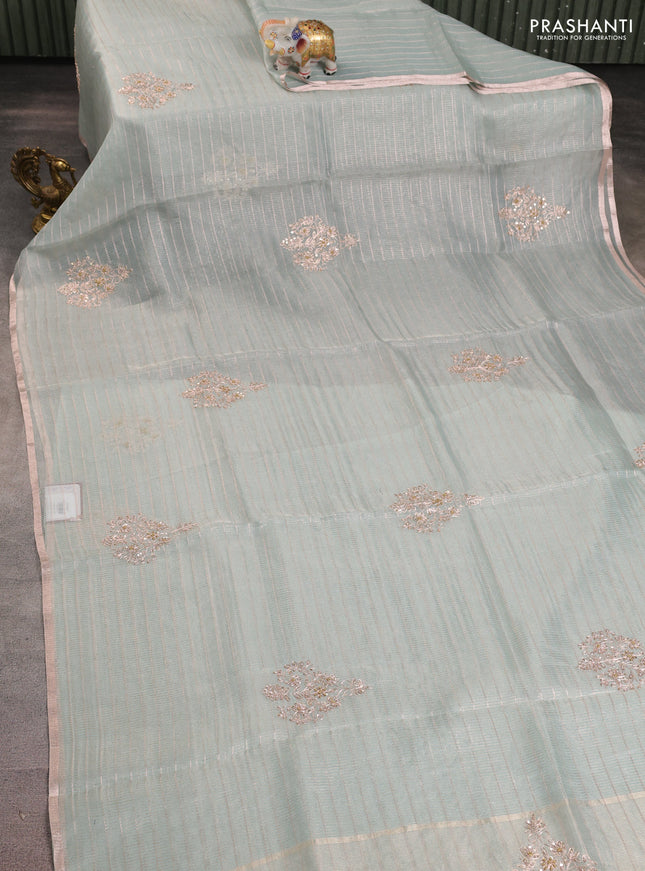 Pure organza silk saree pastel blue shade with allover zari stripe pattern & zardosi work and zari woven piping border