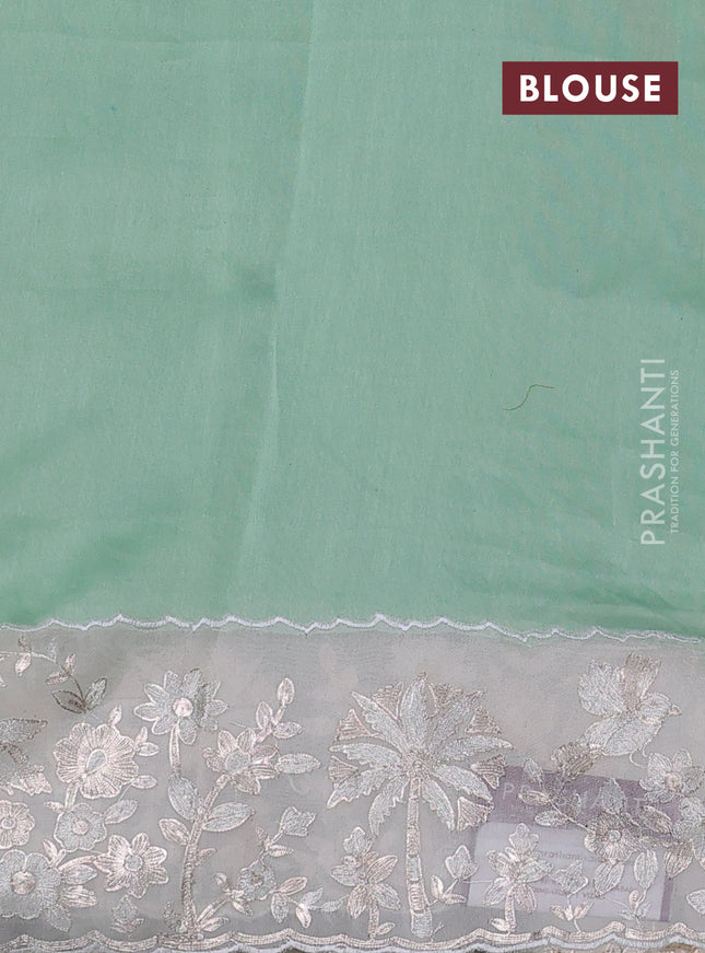 Pure organza silk saree pastel green and cream with allover silver & gold stripes pattern and embroidery border