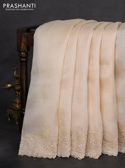 Pure organza silk saree cream with mirror embroidery buttas and embroidered beaded border