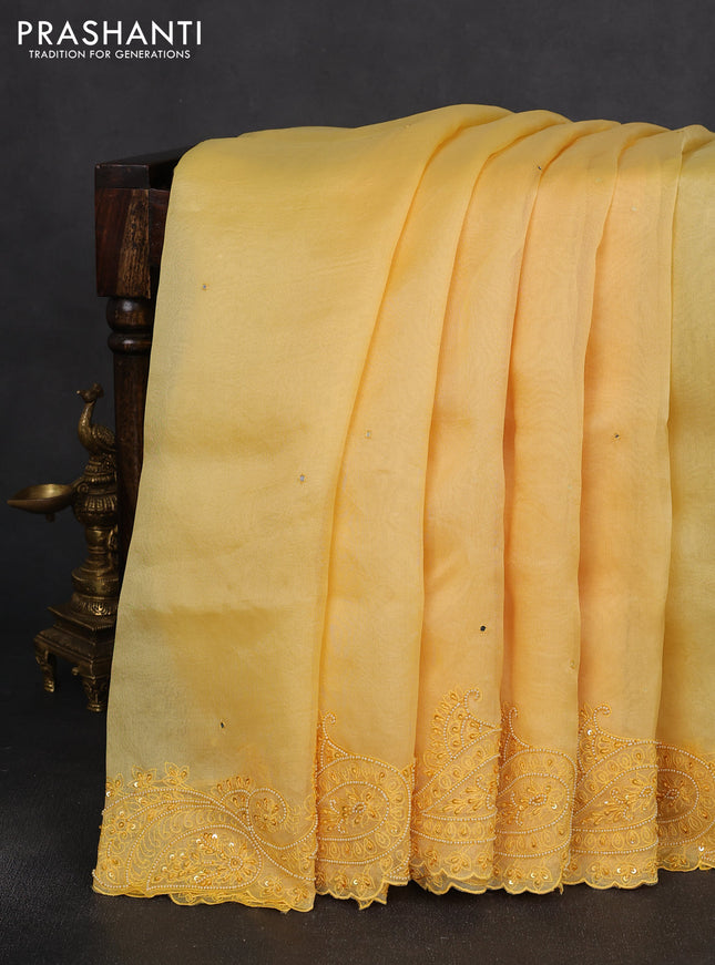 Pure organza silk saree yellow with mirror embroidery buttas and embroidered beaded border