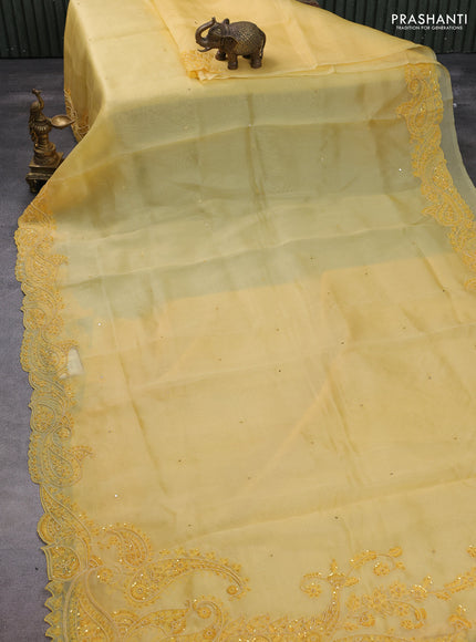 Pure organza silk saree yellow with mirror embroidery buttas and embroidered beaded border