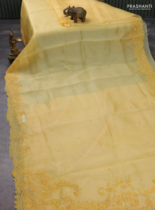 Pure organza silk saree yellow with mirror embroidery buttas and embroidered beaded border
