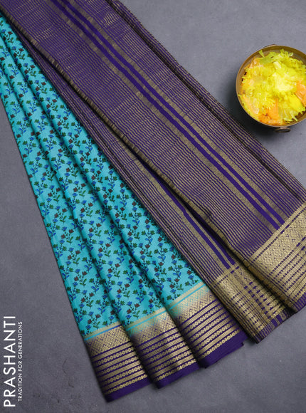Semi mysore silk saree teal blue and navy blue with allover prints and zari woven border
