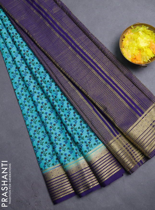 Semi mysore silk saree teal blue and navy blue with allover prints and zari woven border