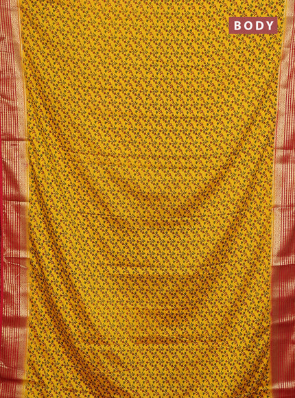 Semi mysore silk saree yellow and red with allover prints and zari woven border