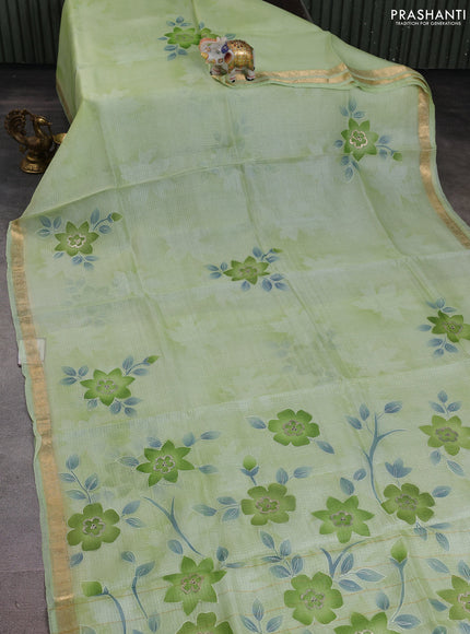 Silk kota saree pista green with floral embroidery buttas and zari woven border