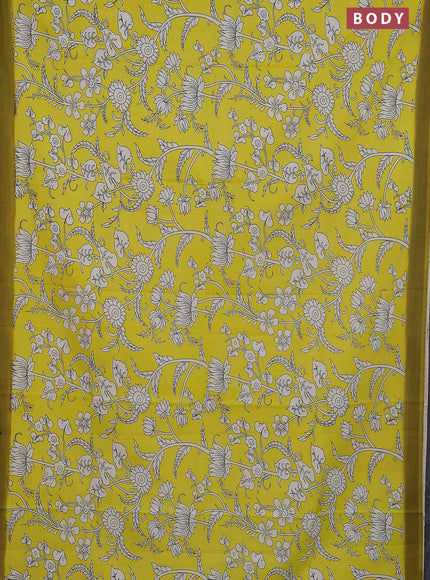 Kalamkari semi silk saree yellow and light green with allover prints and simple border