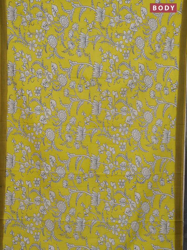 Kalamkari semi silk saree yellow and light green with allover prints and simple border