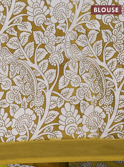 Kalamkari semi silk saree yellow and light green with allover prints and simple border