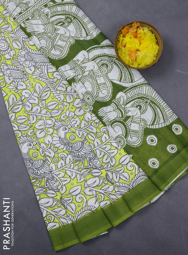 Kalamkari semi silk saree fluorescent green and green with allover prints and simple border