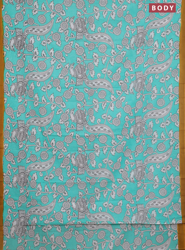 Kalamkari semi silk saree teal green and mustard yellow with allover prints and simple border