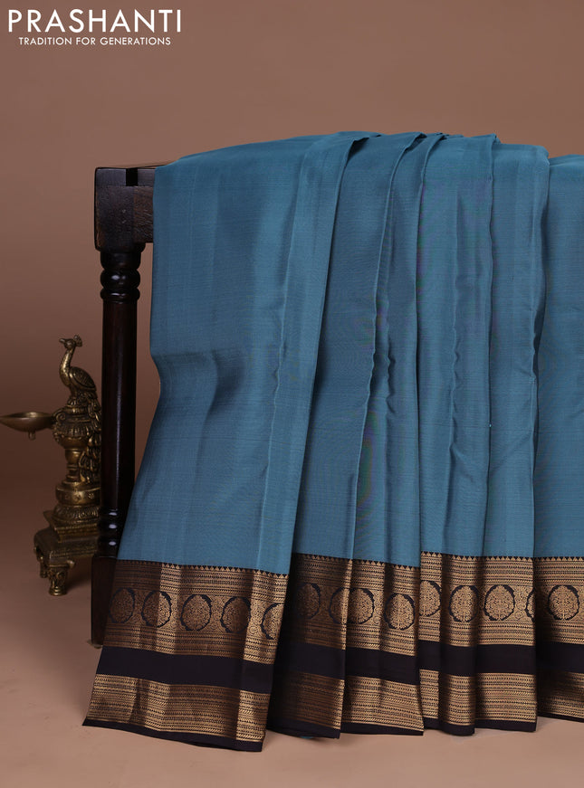 Kanchipuram silk saree pastel blue and coffee brown with plain body and rettapet zari woven border