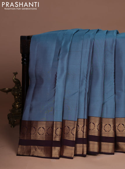 Kanchipuram silk saree pastel blue and coffee brown with plain body and rettapet zari woven border
