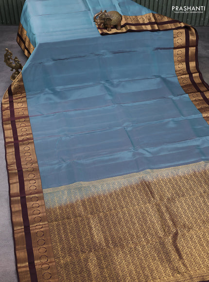 Kanchipuram silk saree pastel blue and coffee brown with plain body and rettapet zari woven border
