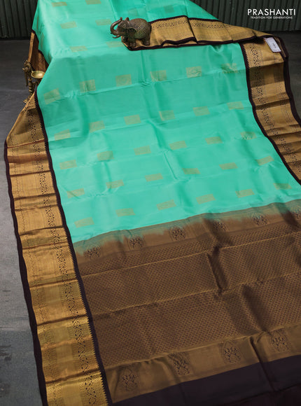Kanchipuram silk saree teal green and coffee brown with allover zari woven buttas and long zari woven border