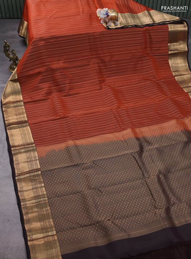 Kanchipuram silk saree rustic orange and coffee brown with allover zari weaves and zari woven korvai border