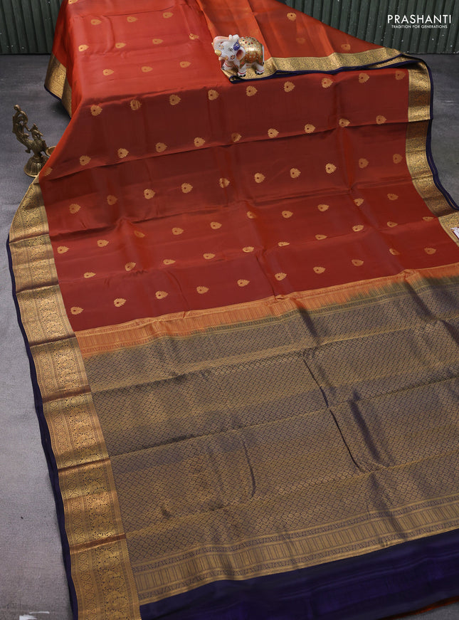 Kanchipuram silk saree rustic orange and navy blue with zari woven buttas and annam zari woven border