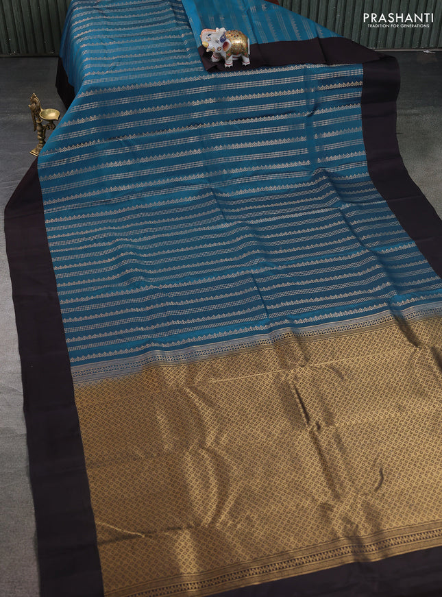 Kanchipuram silk saree peacock blue and coffee brown with allover zari weaves and simple border