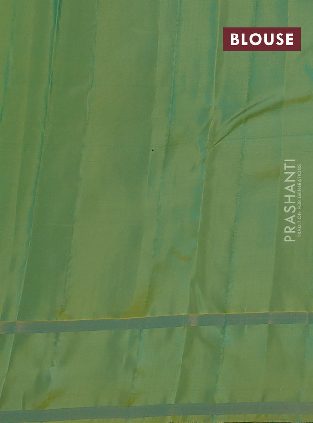 Kanchipuram silk saree teal green and light green with allover zari weaves and rettapet zari woven border