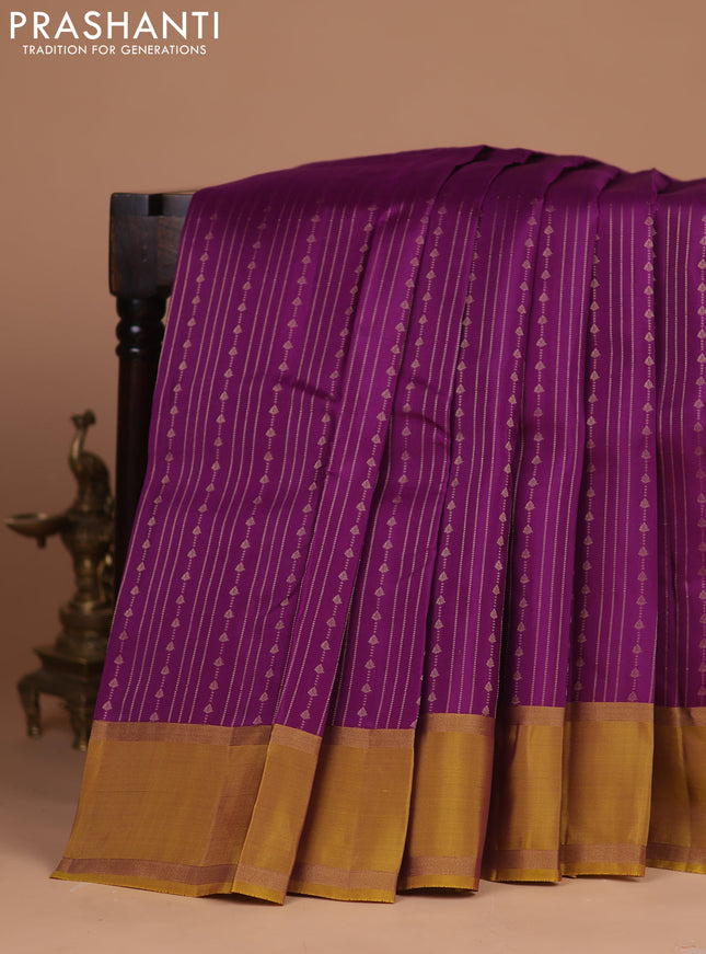 Kanchipuram silk saree purple and dark mustard with allover zari weaves and rettapet zari woven border
