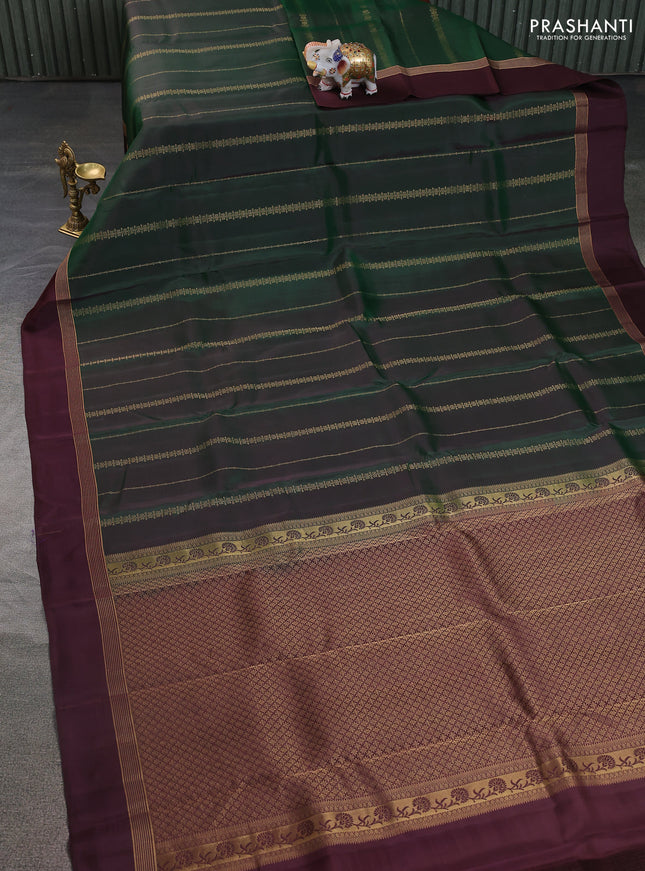 Kanchipuram silk saree bottle green and coffee brown with allover zari weaves and zari woven simple border
