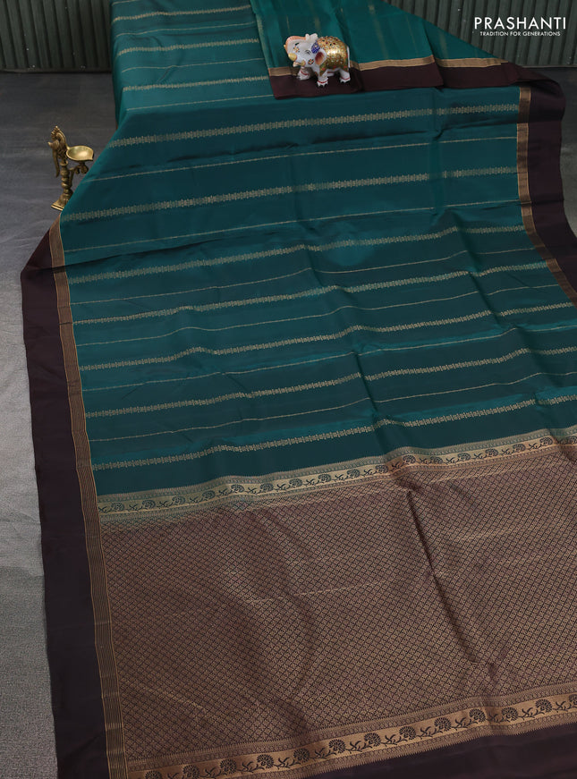 Kanchipuram silk saree green and coffee brown with allover zari weaves and zari woven simple border