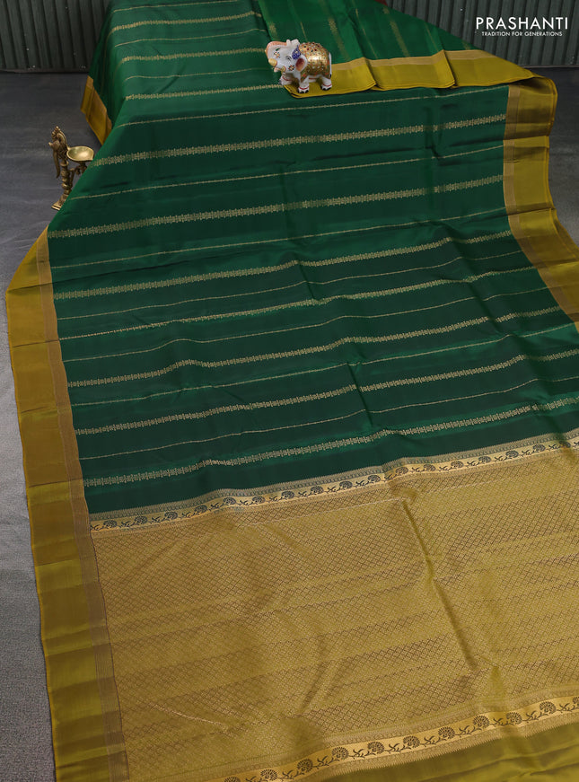Kanchipuram silk saree green and dark mustard with allover zari weaves and zari woven simple border