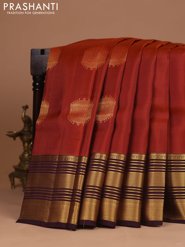 Kanchipuram silk saree rustic orange and wine shade with zari woven buttas and long zari woven border
