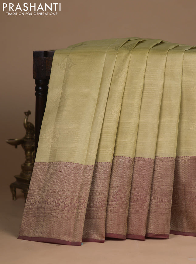 Kanchipuram silk saree sandal and maroon with allover zari weaves & buttas and long zari woven border