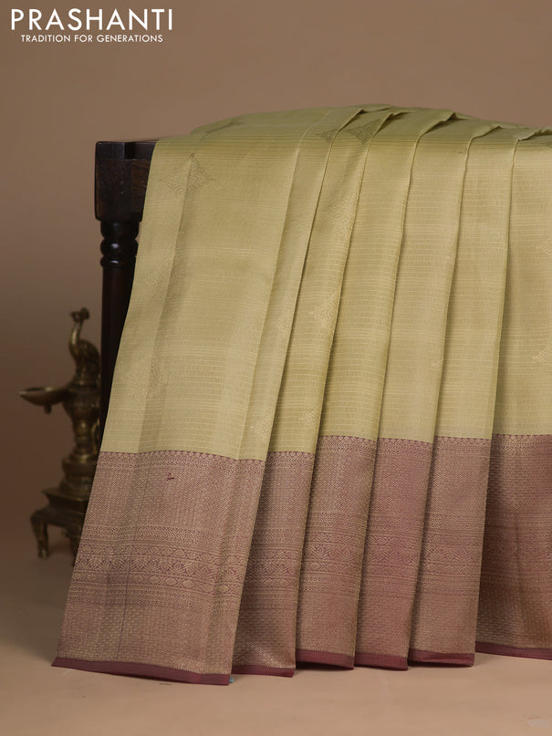 Kanchipuram silk saree sandal and maroon with allover zari weaves & buttas and long zari woven border