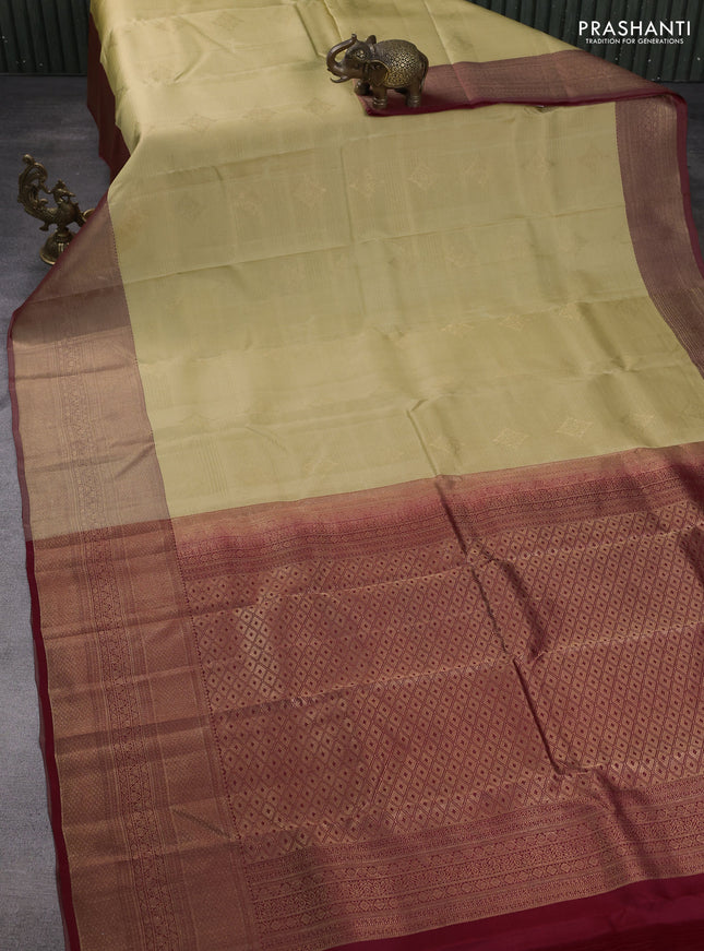 Kanchipuram silk saree sandal and maroon with allover zari weaves & buttas and long zari woven border