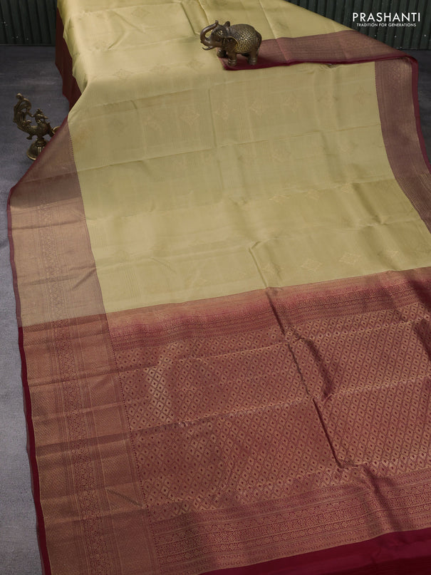 Kanchipuram silk saree sandal and maroon with allover zari weaves & buttas and long zari woven border