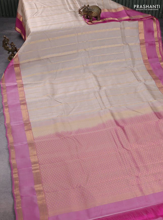 Kanchipuram silk saree beige and pink with allover zari weaves and rettapet zari woven border