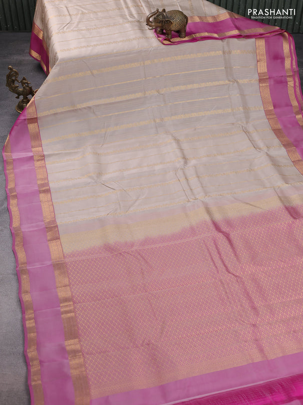 Kanchipuram silk saree beige and pink with allover zari weaves and rettapet zari woven border