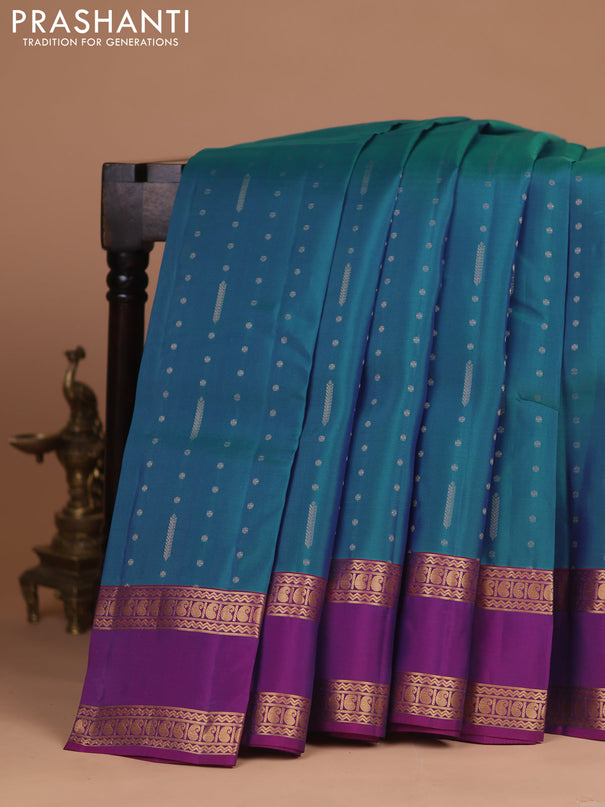 Kanchipuram silk saree peacock blue and purple with allover zari woven buttas and rettapet zari woven korvai border