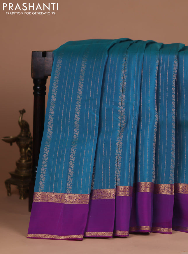 Kanchipuram silk saree peacock blue and purple with allover zari weaves and rettapet zari woven border